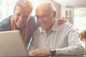 Hispanic couple using laptop