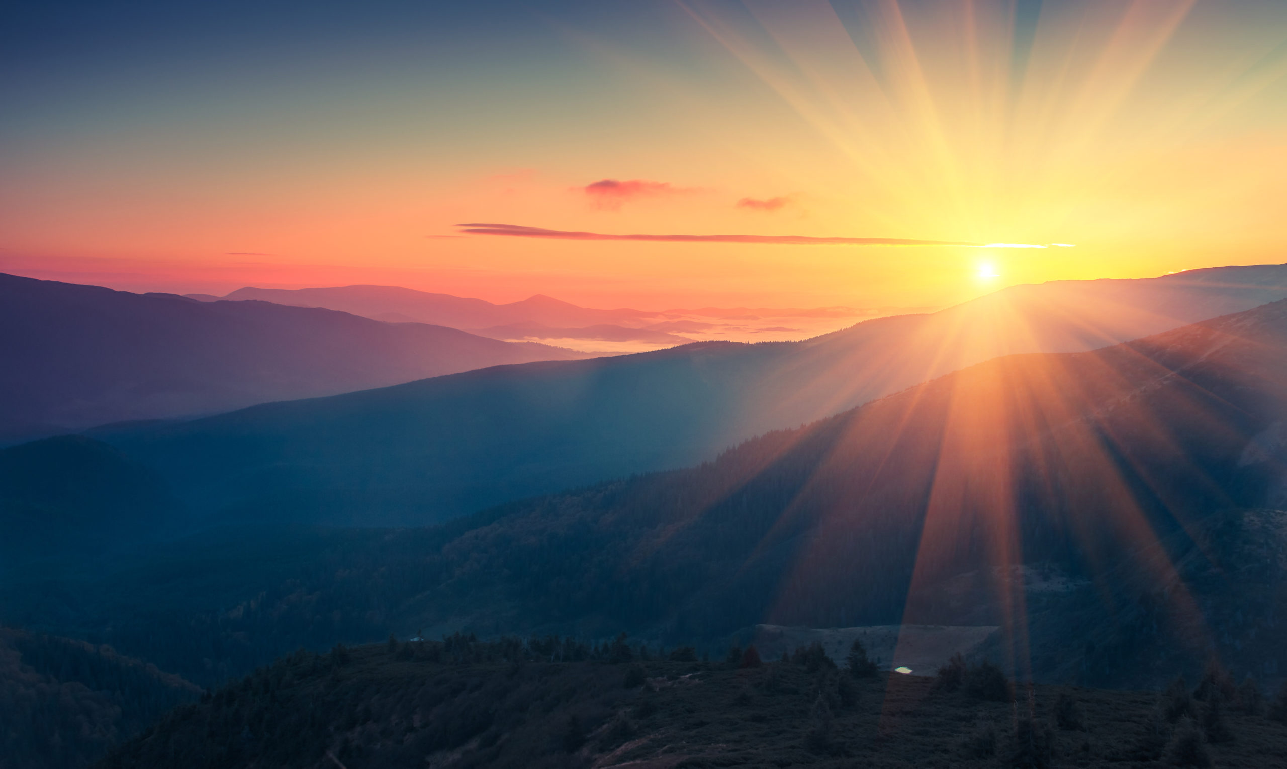 Panoramic view of colorful sunrise in mountains. Filtered image: cross processed vintage effect.