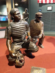 Sculptures and a historic photo from the Negro Leagues Baseball Museum in Kansas City, Mo., honoring African American baseball players and their impact on the social advancement of America.