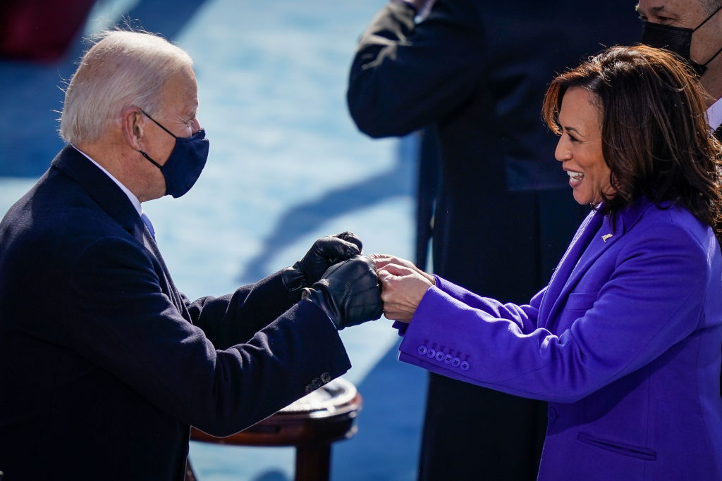 WASHINGTON, DC - JANUARY 20: U.S. President-elect Joe Biden fist bumps newly sworn-in Vice President Kamala Harris after she took the oath of office on the West Front of the U.S. Capitol on January 20, 2021 in Washington, DC. Biden was sworn in today as the 46th president of the United States. (Photo by Drew Angerer/Getty Images)