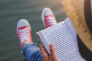 Relaxed Young Woman Reading A Book In Quiet Nature, Concept Read A Books.