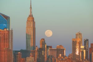NEW YORK, USA - APRIL 26: Full moon rises behind Empire State Building during sunset in New York City, United States on April 26, 2021. (Photo by Tayfun Coskun/Anadolu Agency via Getty Images)