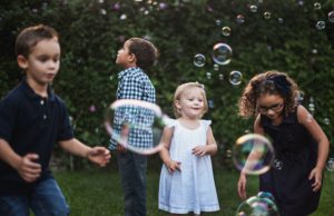 Children blowing bubbles