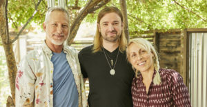 Anton Troy (center) transforms a traumatic event into an opportunity for growth through his Buddhist practice and the support of his legal caregivers (l-r) Gabe and Kiki.