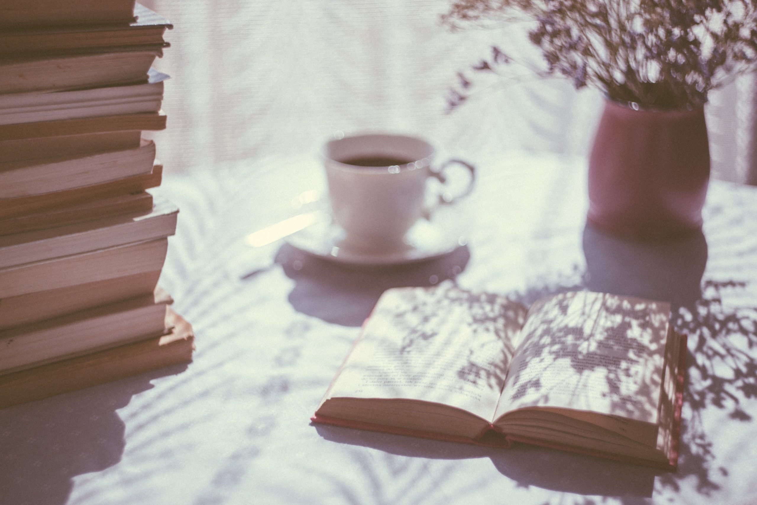 A journal with shadows and cup of coffee