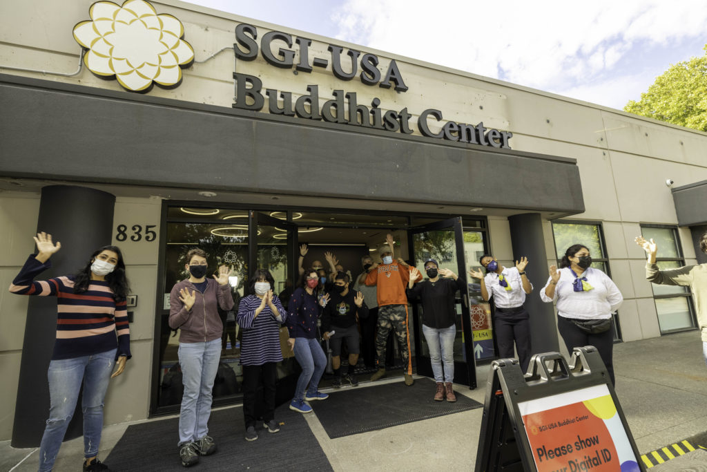 Opening—SGI-USA members give a rousing welcome at the opening of the Seattle Buddhist Center, Seattle, Oct. 3, 2021