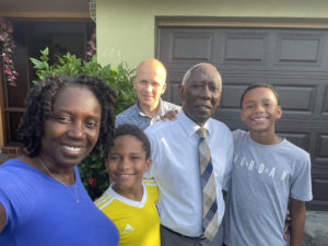 Rachel with her family and father (center) in Orlando, Fla., 2021.
