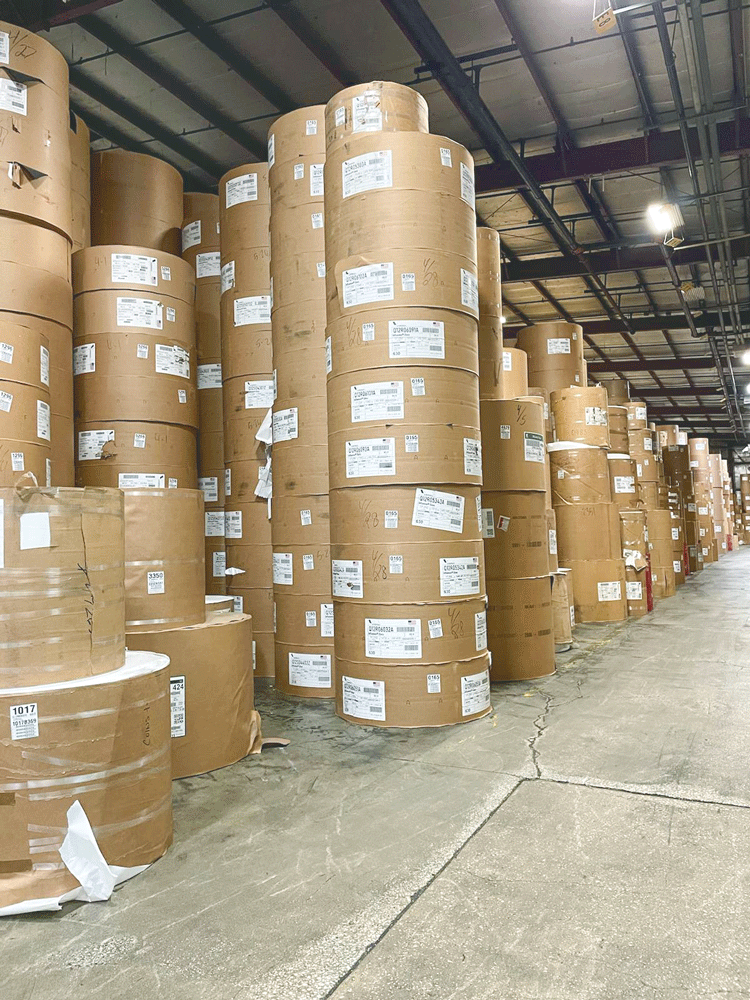 Big Stack Of Printing Paper Rolls In Warehouse Stock Photo